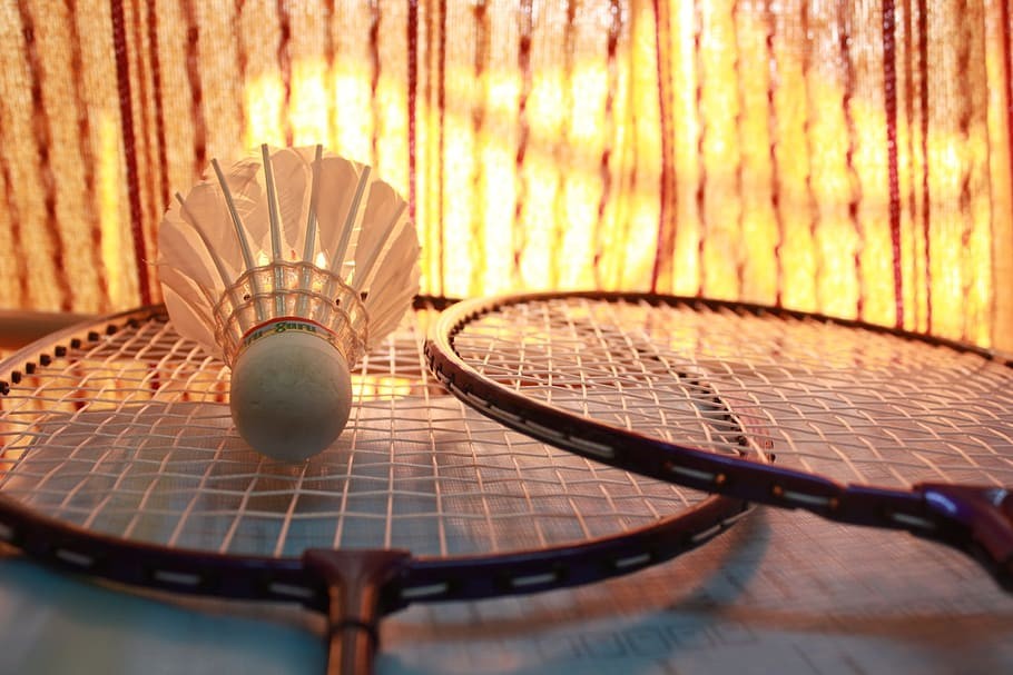 badmintonn coach sportif avec son élève